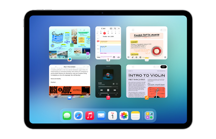En iPad i liggende retning viser seks åpne vinduer fordelt på to rader, inkludert Kalender-appen, Notater-appen, Musikk-appen og Safari.